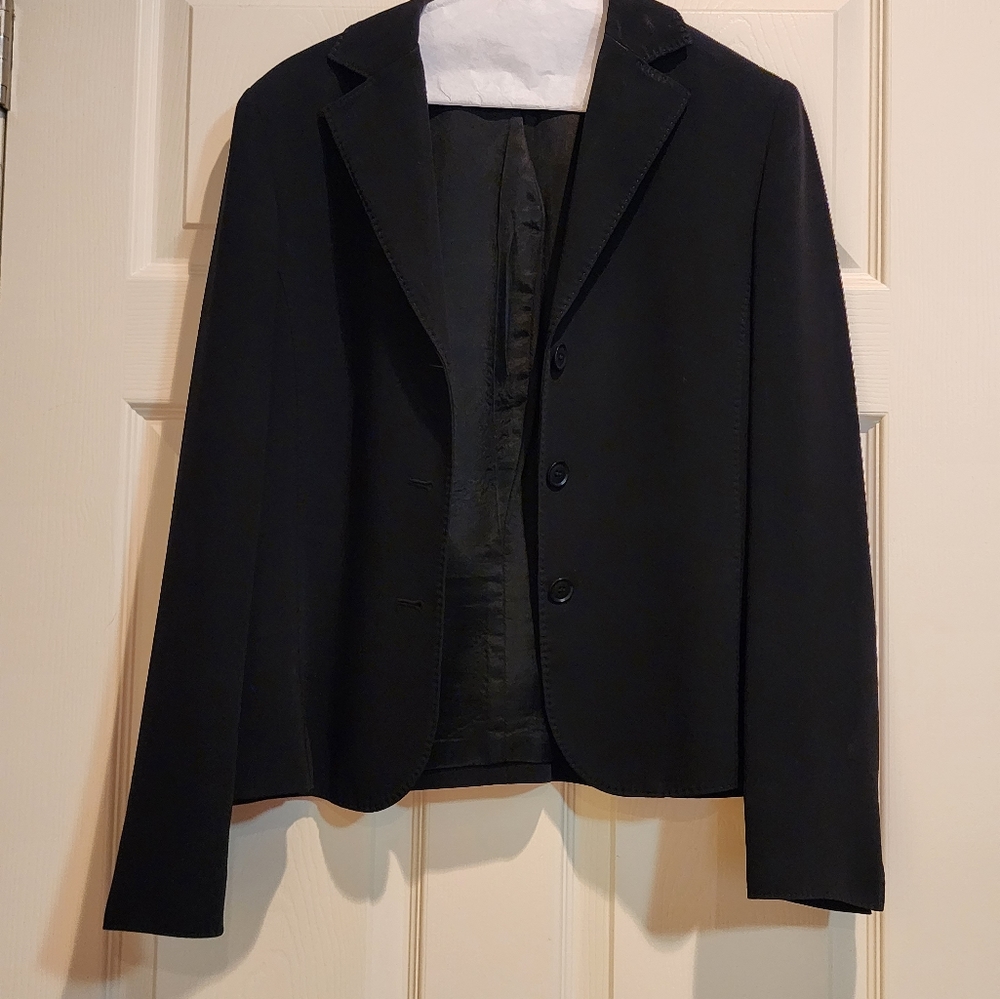 Black suit jacket with detailed atiching on collar and lapel